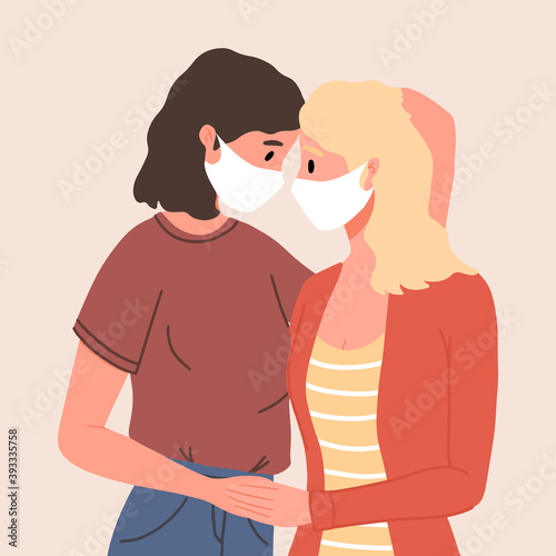 Lesbian female couple in face mask hugging, gay couple. Woman hug and kiss. Homosexuality. LGBTQ+ people, lesbians, human rights freedom. Love relationship, romantic date. Valentine's Day.