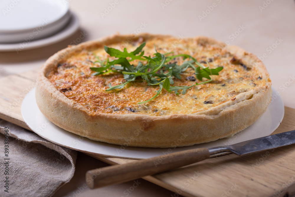 Traditional French Quiche with cheese, spinach and chicken. Quiche lorraine. French cuisine. Top view. Light wooden background Traditional French Quiche with cheese, spinach and chicken. Quiche lorraine. French cuisine. Top view. Light wooden background