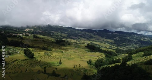 Aerial view of farmland and cloudscape of Yuanyang Terrace Scenic Area