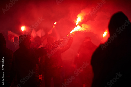 Obraz na płótnie flaming red flare during a street protest in the city w salonie