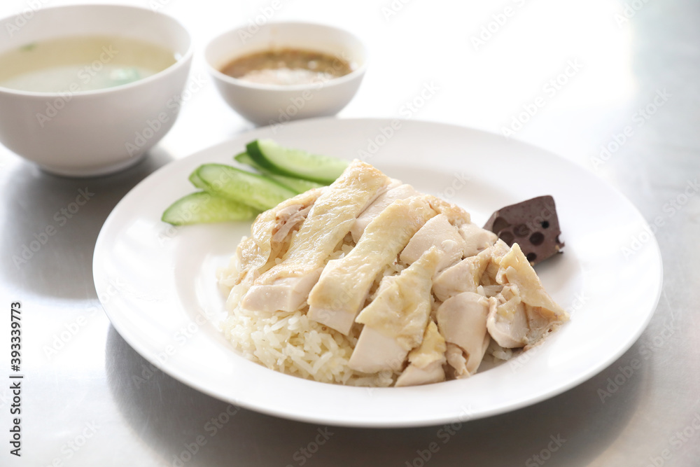 Thai food gourmet steamed chicken with rice khao mun kai in wood background Thai food gourmet steamed chicken with rice khao mun kai in wood background