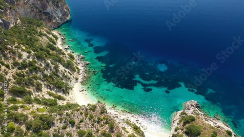 Aerial drone video of turquoise paradise sandy beach and bay of Filatro a safe sail boat anchorage in Ithaki or Ithaca island, Ionian, Greece photo