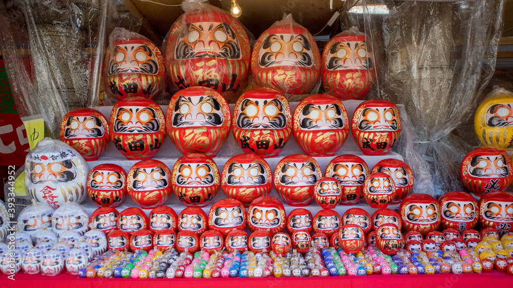 Daruma Doll with various size sold in a stall, Daruma is a traditional doll from Japan