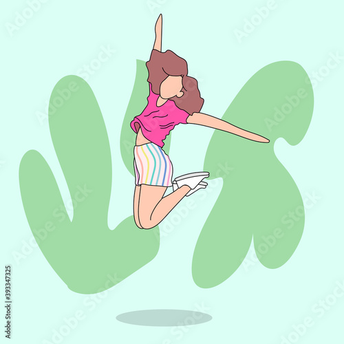 Caucasian girl jumping against the wall. She are having fun.