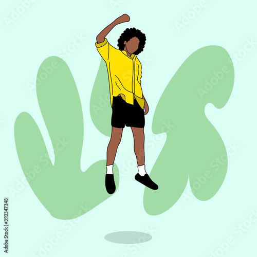 Black boy jumping against the wall. They are having fun. They are wearing casual clothes