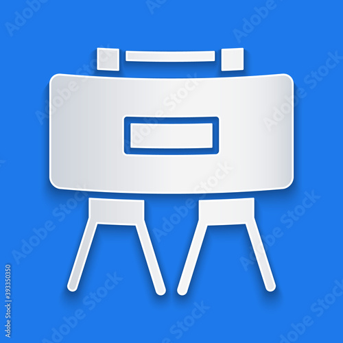 Paper cut Military mine icon isolated on blue background. Claymore mine explosive device. Anti personnel mine. Army explosive. Paper art style. Vector.