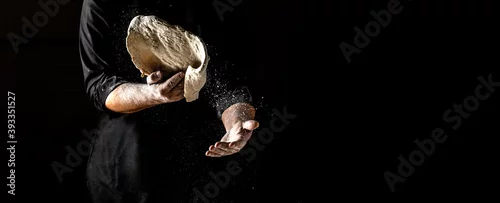 Obraz  z motywem male hands making dough for pizza with flour scattering. banner, menu, recipe, place for text