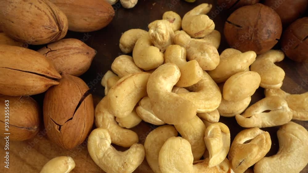 Assorted nuts on a wooden board. Assorted nuts on a wooden board.