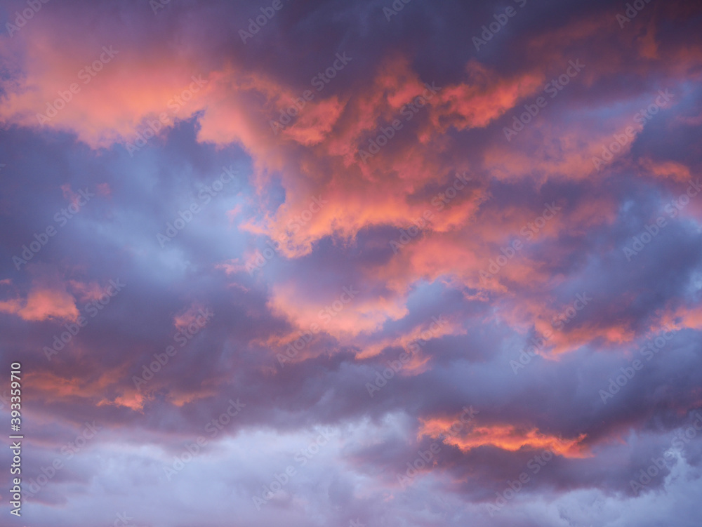 Beautiful clouds of blue, pink and orange colors at sunset
