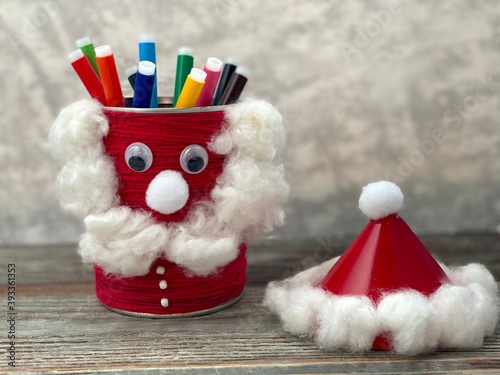 Kids craft Santa Claus from simple material, recycling empty jar. Stand for pencils.