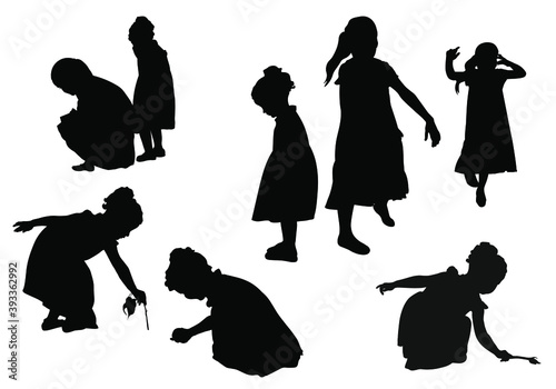 Eight vector silhouettes of little girls playing isolated on white background. 