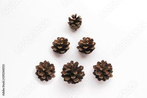 Composition in the form of Christmas tree from pine cones. Christmas and New year concept.