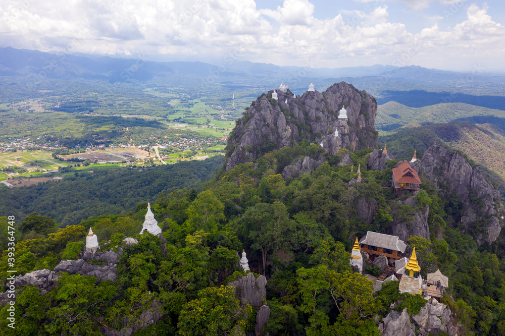 Aerial view over Wat Chalermprakiat temple on the rock cliffs of Lampang, Thailand