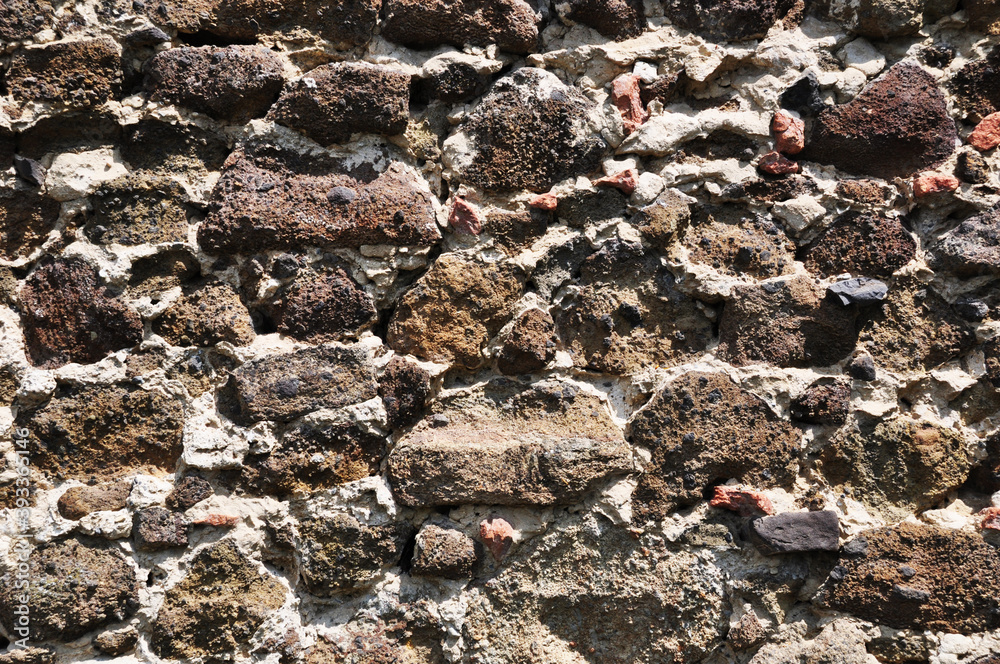 Background, texture, porous stone masonry, on cement mortar Background, texture, porous stone masonry, on cement mortar