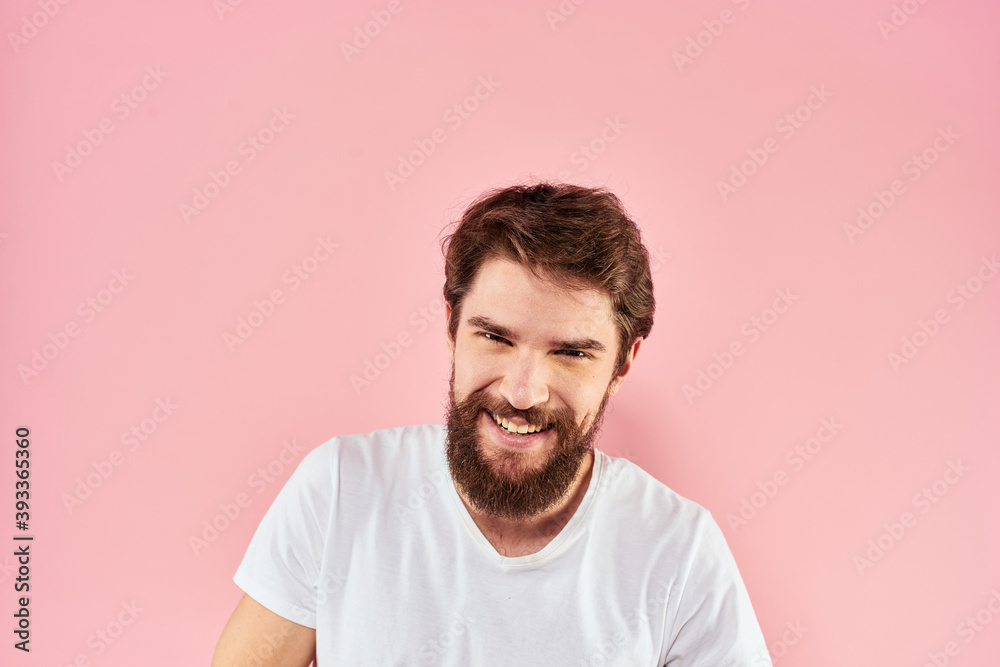 Bearded man white t-shirt cropped view lifestyle studio pink background Bearded man white t-shirt cropped view lifestyle studio pink background