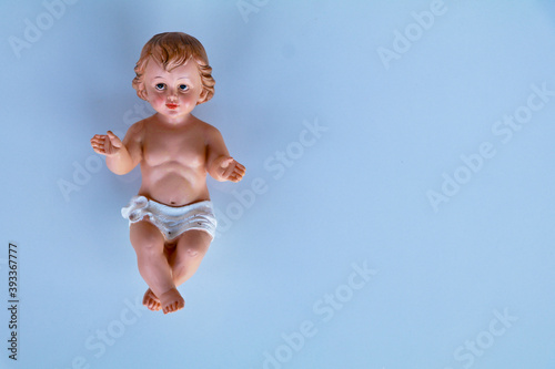 Obraz na plátně Small statue of Infant Jesus on white background, Christmas concept