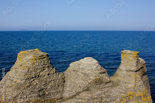 Coastal limestone formations, Byrums raukar on the swedish island Oland, stones close to the sea photo