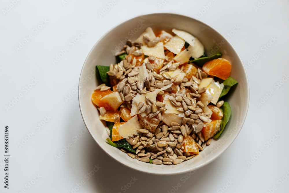 A mixed vegetable salad.Bowl of healthy vegetable salad isolated on white background, top view. Healthy food, vegetarian dieting.Salad with spinach. A mixed vegetable salad.Bowl of healthy vegetable salad isolated on white background, top view. Healthy food, vegetarian dieting.Salad with spinach.