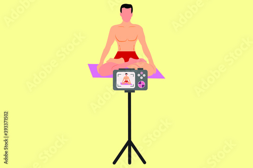 male yoga instructor recording his poses in camera