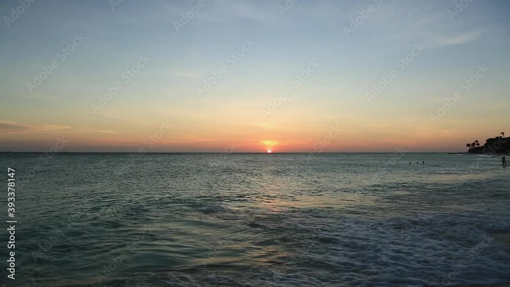 Beautiful sunset on Eagle Beach of Aruba Island. Caribbean. Amazing nature background. Beautiful sunset on Eagle Beach of Aruba Island. Caribbean. Amazing nature background.
