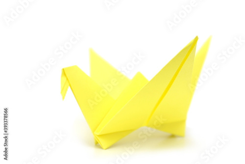 A yellow origami bird