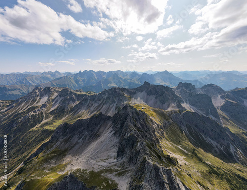 Fototapeta Naklejka Na Ścianę i Meble -  Mountain Panorama with the view on the Walser Hammerspitze in Kleinwalsertal Austria - Drone Perspective Landscape Photography