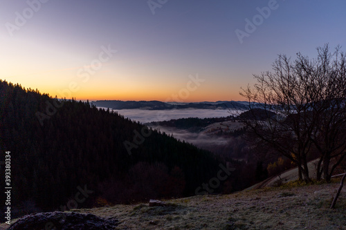 sunrise view from the mountains of Romania autumn with fog