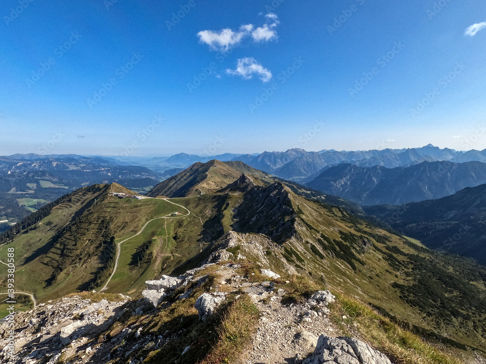 Fototapeta premium Beautiful view from the Fellhorn on a mountain ridge in the Kleinwalsertal Austria on a sunny day - Landscape Photography