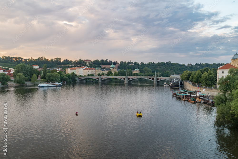 Panoramic view of Vltava river in Prague at sunset time.