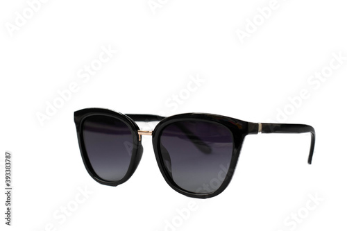 Female black sunglasses isolated on white background. Selective focus.