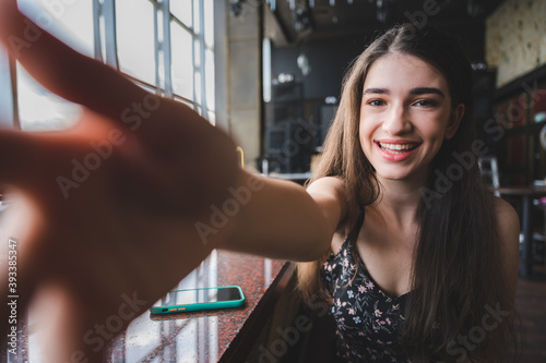 young cute women taking selfie