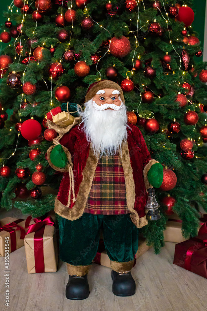 Santa Claus with gift and Christmas tree Santa Claus with gift and Christmas tree