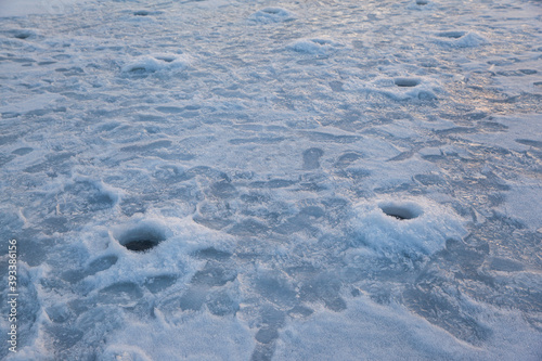 holes in the ice for winter fishing