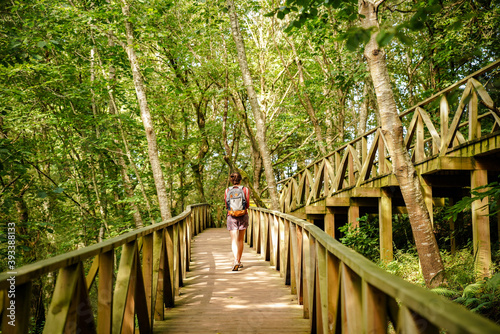 woman walking natural park forest photo