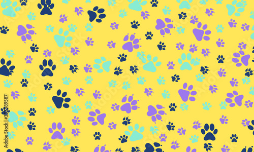 Colorful dog pawn print pattern on yellow background.