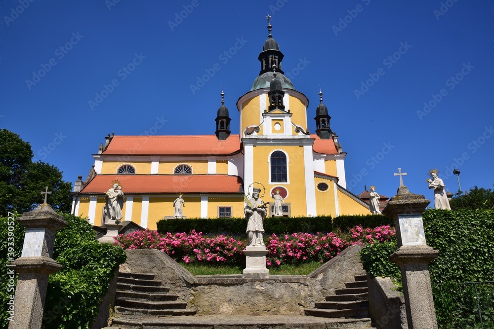 The Church of the Assumption of the Virgin Mary in Chlum by Trebon in summer with clear blue sky. Baroque church from 18th century, Trebon, Czech Republic.