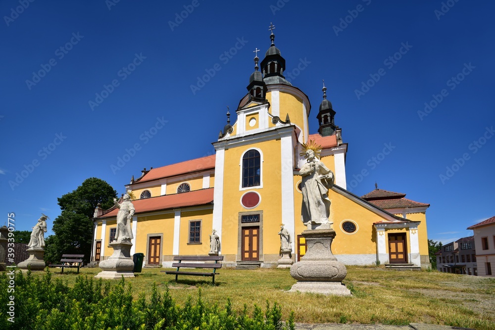 The Church of the Assumption of the Virgin Mary in Chlum by Trebon in summer with clear blue sky. Baroque church from 18th century, Trebon, Czech Republic.