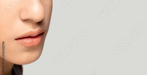 Lips, flyer. Close up portrait of beautiful jewish female model. Parts of face and body. Beauty, fashion, skincare, cosmetics, wellness concept. Well-kept skin aesthetic, fresh look, details.