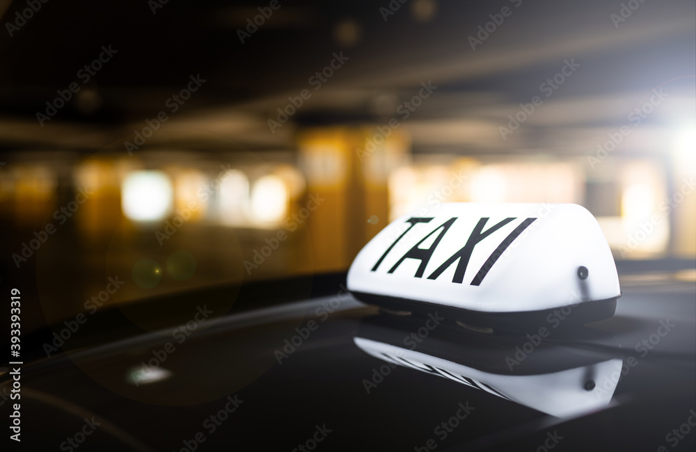 taxi in the city - order by apps - dark background