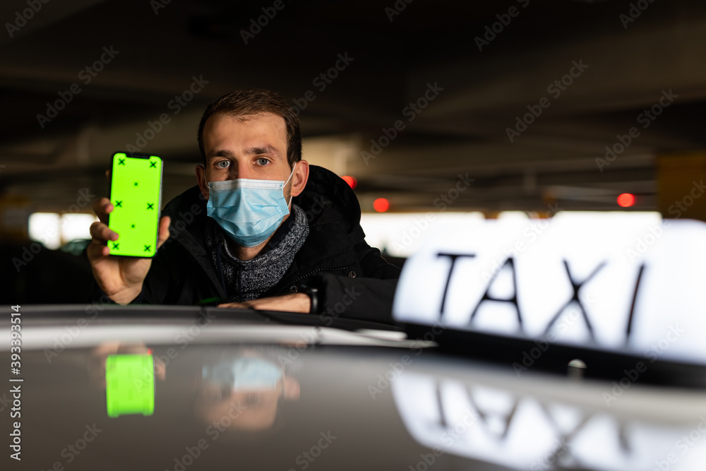 Taxi driver showing something on greenscreen on his phone
