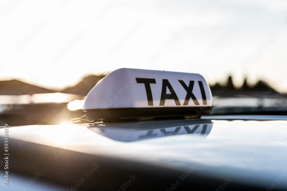Taxi sign with the view at the sky
