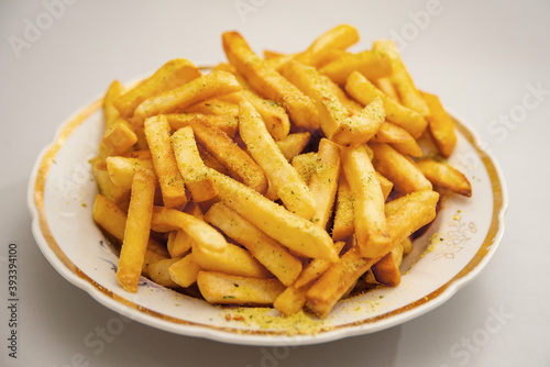 Seasoned fries are on the plates.