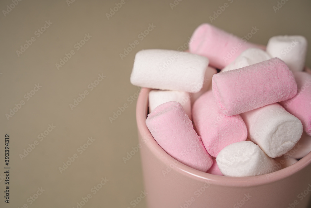 Pink cocoa glass filled with pink marshmallows