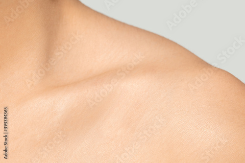 Collarbones. Close up portrait of beautiful jewish female model. Parts of face and body. Beauty, fashion, skincare, cosmetics, wellness concept. Well-kept skin aesthetic, fresh look, details.