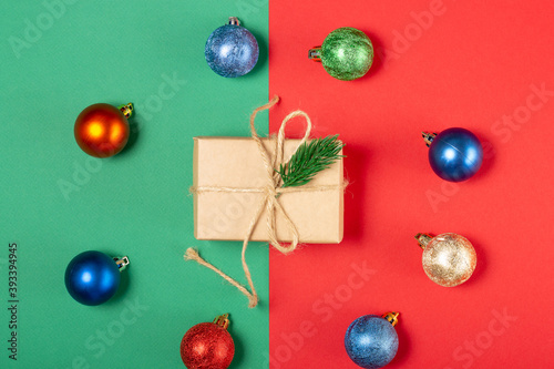 Bright gift boxes and Christmas decorations, on a green background. Top view, holiday and Christmas concept.