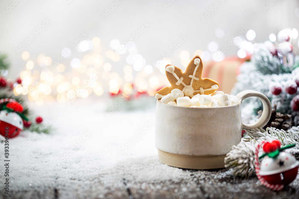 Christmas decorations on snow with cup of hot chocolate, gingerbread, fir tree branches and christmas lights. Winter Decoration Background Christmas decorations on snow with cup of hot chocolate, gingerbread, fir tree branches and christmas lights. Winter Decoration Background