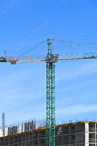 Crane and highrise construction site