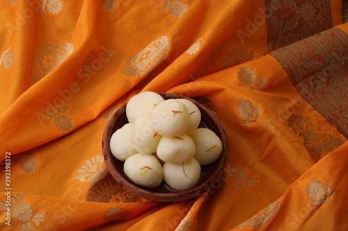 Famous Indian dessest rasgulla/ rosogulla/ roshogulla served in earthan bowl photo