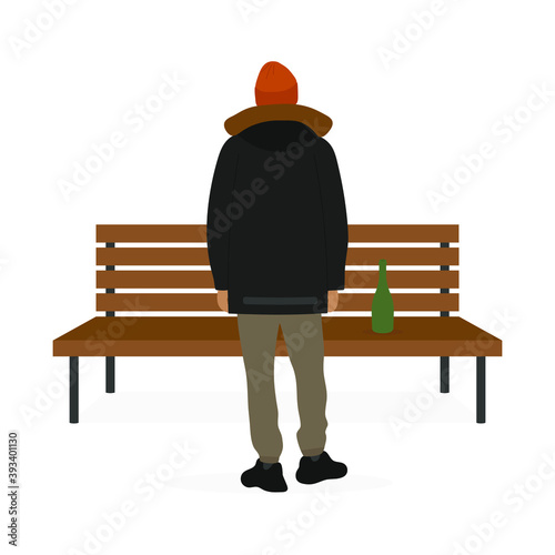 A male character stands near a bench on which a bottle stands
