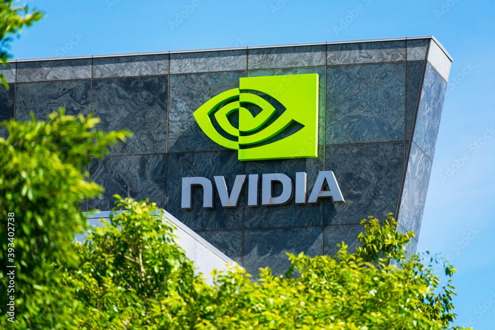 Nvidia logo and sign on headquarters. Blurred foreground with